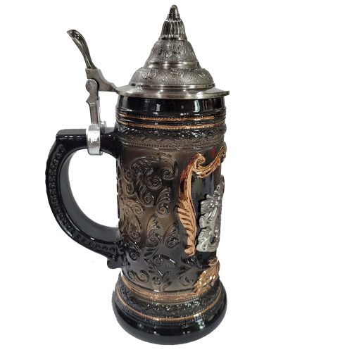 Side view of ornate ceramic beer tankard with embossed gold scrollwork and silver metal lid.